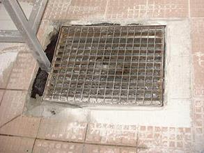 Damaged tiles on kitchen floor